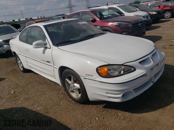 1999 Pontiac Grand Am GT z VIN 1G2NW12E0XM853038, wystawiony jako Copart lot #69262194 z przebiegiem 162 986 mil mil oraz Szkoda całkowita • Salvage title. Historia ofert i sprzedaży dostępna na DreamBid. Obrazek 4.