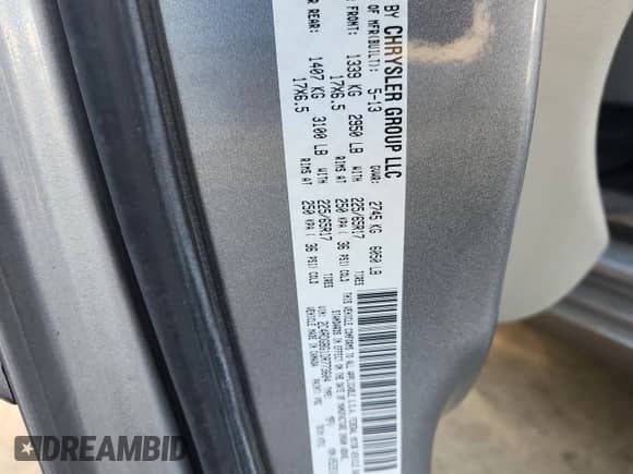 2013 Dodge Grand Caravan SE with VIN 2C4RDGBG1DR773604, listed as a Copart auction lot 85499055 with 137,449 mi miles and Salvage title. Bid and sale history available at DreamBid. Image 13.