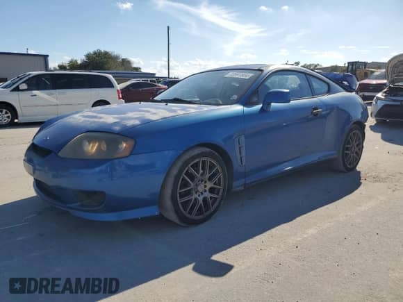 2005 Hyundai Tiburon GS с VIN KMHHM65D55U174910, выставлен на аукционе Copart как лот 72691804 с пробегом 161 764 миль миль и Списание • Salvage title. История ставок и продаж доступна на DreamBid. Изображение 1.