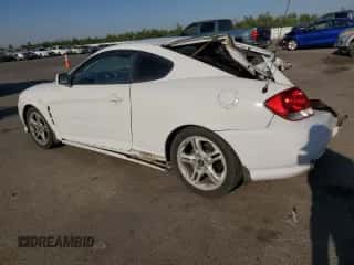 2006 Hyundai Tiburon GT с VIN KMHHN65F46U191990, выставлен на аукционе Copart как лот 61887894 с пробегом 252 384 миль миль и Списание • Salvage title. История ставок и продаж доступна на DreamBid. Изображение 2.