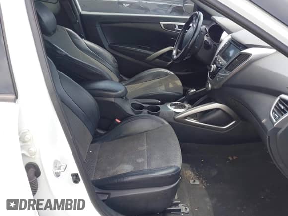 2014 Hyundai Veloster с VIN KMHTC6AD1EU199273, выставлен на аукционе IAAI как лот 42759448 с пробегом 174 507 миль миль и . История ставок и продаж доступна на DreamBid. Изображение 5.