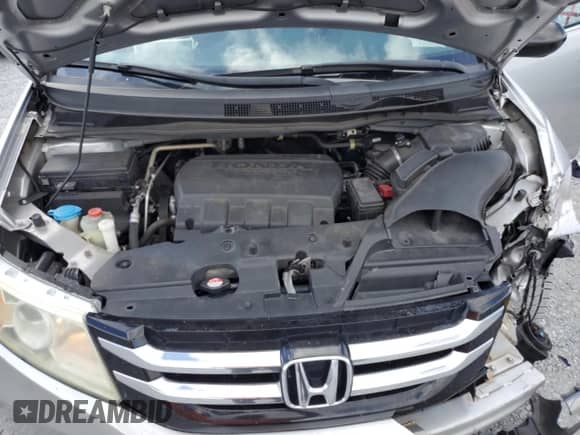 2015 Honda Odyssey LX with VIN 5FNRL5H22FB025431, listed as a Copart auction lot 82373215 with 112,487 mi miles and Salvage title. Bid and sale history available at DreamBid. Image 12.