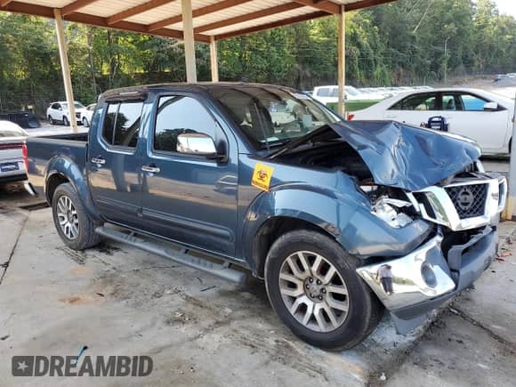 2013 Nissan Frontier SL with VIN 1N6AD0ER2DN712919, listed as a Copart auction lot 62019235 with 242,539 mi miles and Salvage title. Bid and sale history available at DreamBid. Image 4.