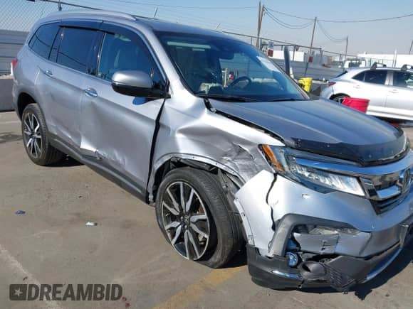 2020 Honda Pilot Touring 7-Passenger z VIN 5FNYF5H65LB006048, wystawiony jako IAAI lot #41294635 z przebiegiem 32 429 mil mil oraz . Historia ofert i sprzedaży dostępna na DreamBid. Obrazek 6.