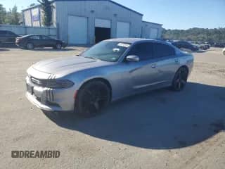 2016 Dodge Charger SXT with VIN 2C3CDXHG8GH214238, listed as a Copart auction lot 87372815 with 201,996 mi miles and Salvage title. Bid and sale history available at DreamBid. Image 1.