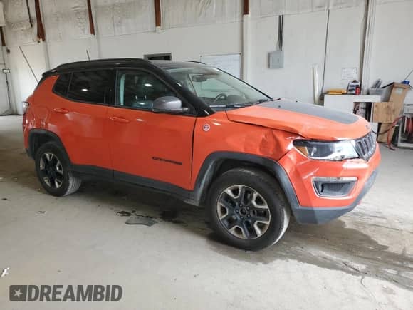2017 Jeep Compass Trailhawk with VIN 3C4NJDDB0HT667042, listed as a Copart auction lot 71969535 with 75,429 mi miles and Salvage title. Bid and sale history available at DreamBid. Image 4.