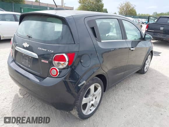 2015 Chevrolet Sonic LTZ with VIN 1G1JE6SB5F4187091, listed as a IAAI auction lot 43239971 with 123,749 mi miles and . Bid and sale history available at DreamBid. Image 4.