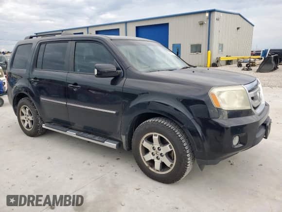 2009 Honda Pilot Touring with VIN 5FNYF48809B035719, listed as a Copart auction lot 63201775 with 202,385 mi miles and Salvage title. Bid and sale history available at DreamBid. Image 4.