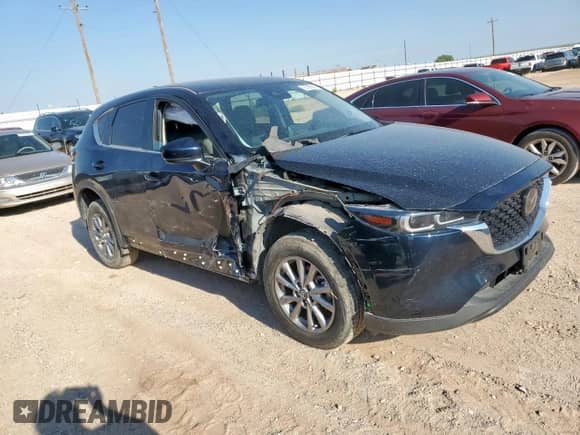2023 Mazda CX-5 S Select with VIN JM3KFBBM0P0285688, listed as a Copart auction lot 67590615 with 28,029 mi miles and Salvage title. Bid and sale history available at DreamBid. Image 4.