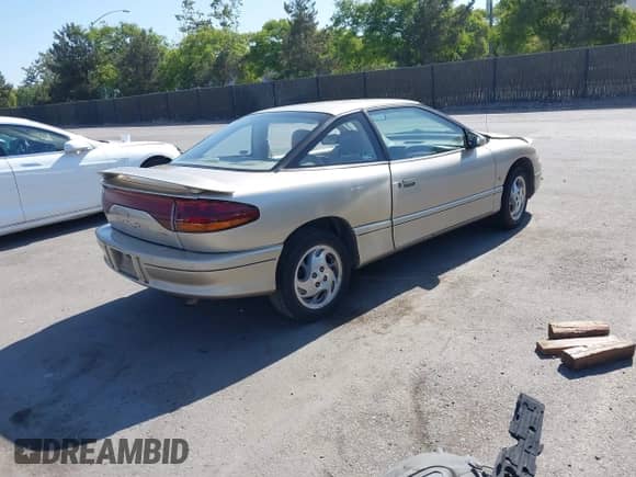 1996 Saturn 2dr Coupe with VIN 1G8ZH1271TZ371582, listed as a IAAI auction lot 42385058 with 152,207 mi miles and . Bid and sale history available at DreamBid. Image 4.