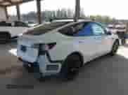 2021 Tesla Model Y Long Range with VIN 5YJYGDEE6MF138868, listed as a IAAI auction lot 43401839 with 134,786 mi miles and . Bid and sale history available at DreamBid. Image 4.