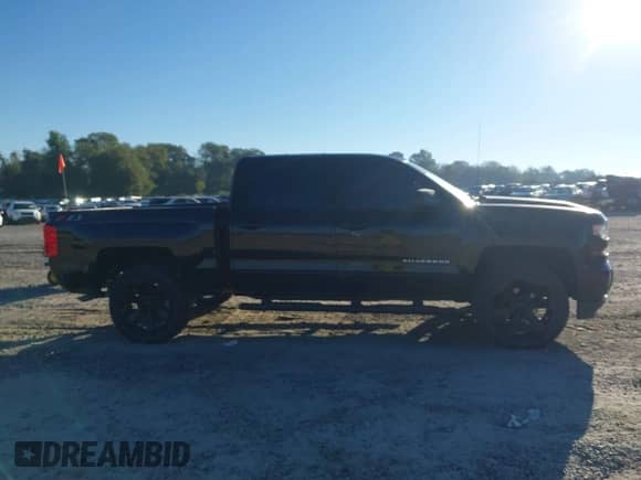 2018 Chevrolet Silverado 1500 LT z VIN 3GCUKRECXJG276511, wystawiony jako IAAI lot #43460009 z przebiegiem 151 453 mil mil oraz . Historia ofert i sprzedaży dostępna na DreamBid. Obrazek 13.