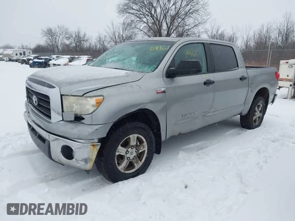 2008 Toyota Tundra with VIN 5TBDV54118S498651, listed as a IAAI auction lot 41139461 with 243,235 mi miles and . Bid and sale history available at DreamBid. Image 2.