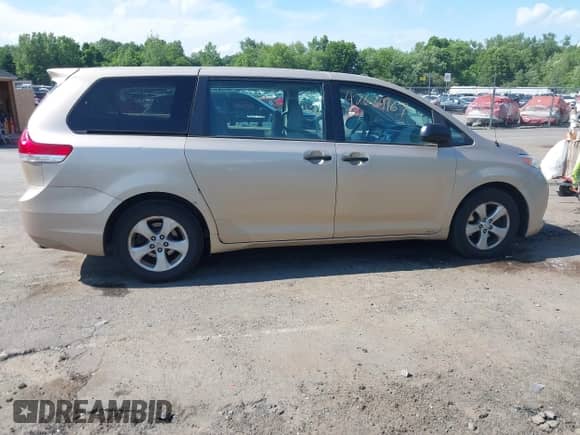 2014 Toyota Sienna L with VIN 5TDZK3DC6ES497292, listed as a IAAI auction lot 42634167 with 211,769 mi miles and . Bid and sale history available at DreamBid. Image 13.