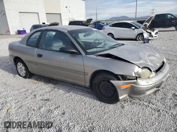 1998 Dodge Neon Highline with VIN 1B3ES42C2WD642821, listed as a Copart auction lot 77038094 with 86,992 mi miles and Salvage title. Bid and sale history available at DreamBid. Image 4.