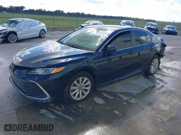 2021 Toyota Camry LE with VIN 4T1C11AK2MU534448, listed as a IAAI auction lot 43111658 with 89,877 mi miles and . Bid and sale history available at DreamBid. Image 17.