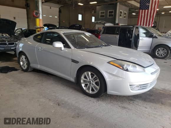 2007 Hyundai Tiburon GS with VIN KMHHM66D37U253610, listed as a Copart auction lot 62200825 with 107,500 mi miles and Salvage title. Bid and sale history available at DreamBid. Image 4.