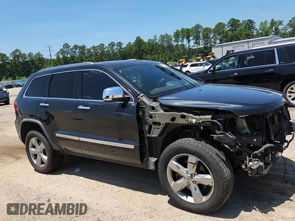 2012 Jeep Grand Cherokee Overland with VIN 1C4RJFCT9CC346497, listed as a Copart auction lot 63004635 with 142,623 mi miles and Salvage title. Bid and sale history available at DreamBid. Image 15.