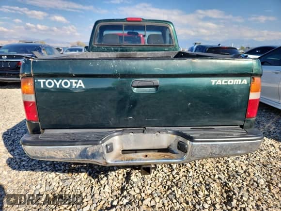 1999 Toyota Tacoma z VIN 4TAPM62N8XZ457865, wystawiony jako Copart lot #85175585 z przebiegiem 222 153 mil mil oraz Szkoda całkowita • Salvage title. Historia ofert i sprzedaży dostępna na DreamBid. Obrazek 6.
