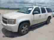 2009 Chevrolet Suburban LTZ z VIN 1GNFK36399R234676, wystawiony jako IAAI lot #42321922 z przebiegiem 419 096 mil mil oraz . Historia ofert i sprzedaży dostępna na DreamBid. Obrazek 2.