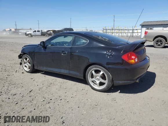 2004 Hyundai Tiburon GT с VIN KMHHN65F94U113699, выставлен на аукционе Copart как лот 53858355 с пробегом 221 999 миль миль и Списание • Salvage title. История ставок и продаж доступна на DreamBid. Изображение 2.