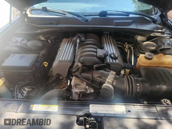 2012 Dodge Challenger z VIN 2C3DYCJ4CH176414, wystawiony jako Copart lot #62613515 z przebiegiem 119 000 mil mil oraz Czysty tytuł • Clean title. Historia ofert i sprzedaży dostępna na DreamBid. Obrazek 7.