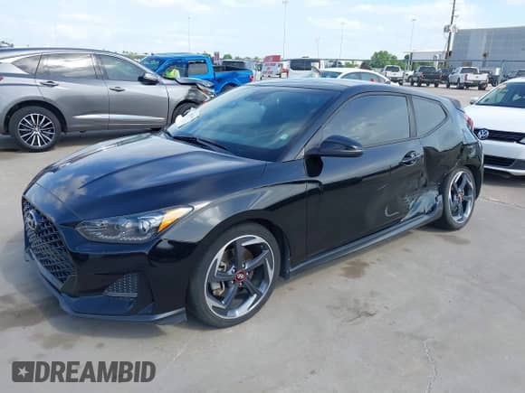 2019 Hyundai Veloster Turbo R-Spec z VIN KMHTH6AB1KU006986, wystawiony jako IAAI lot #42052689 z przebiegiem 92 317 mil mil oraz . Historia ofert i sprzedaży dostępna na DreamBid. Obrazek 2.