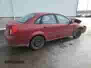 2005 Chevrolet Optra LS с VIN KL1JK59Z25K101251, выставлен на аукционе Copart как лот 87930375 с пробегом 93 894 миль миль и Списание • Salvage title. История ставок и продаж доступна на DreamBid. Изображение 3.