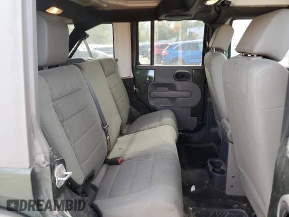 2007 Jeep Wrangler Unlimited Sahara z VIN 1J4GA59187L104520, wystawiony jako Copart lot #86331095 z przebiegiem 213 087 mil mil oraz Czysty tytuł • Clean title. Historia ofert i sprzedaży dostępna na DreamBid. Obrazek 11.