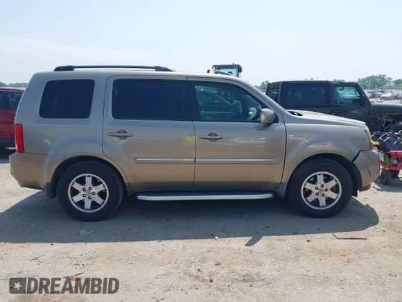 2009 Honda Pilot Touring with VIN 5FNYF38809B004142, listed as a IAAI auction lot 42337103 with 152,874 mi miles and . Bid and sale history available at DreamBid. Image 13.