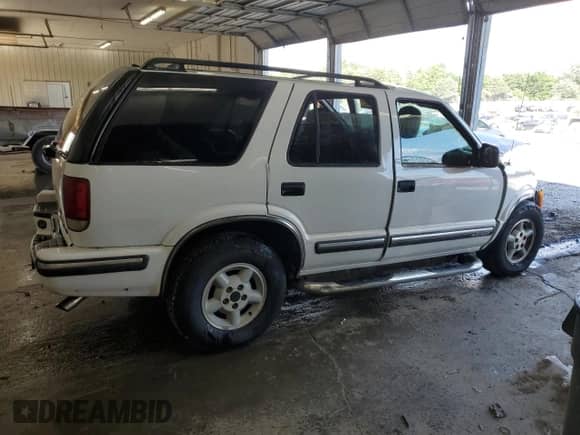 1999 Chevrolet Blazer LT z VIN 1GNDT13W4X2225140, wystawiony jako Copart lot #64834825 z przebiegiem Nie podano mil oraz Nie do naprawy • Non repairable. Historia ofert i sprzedaży dostępna na DreamBid. Obrazek 3.