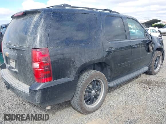 2013 Chevrolet Tahoe LS with VIN 1GNSKAE09DR234776, listed as a IAAI auction lot 42605423 with 200,433 mi miles and . Bid and sale history available at DreamBid. Image 4.