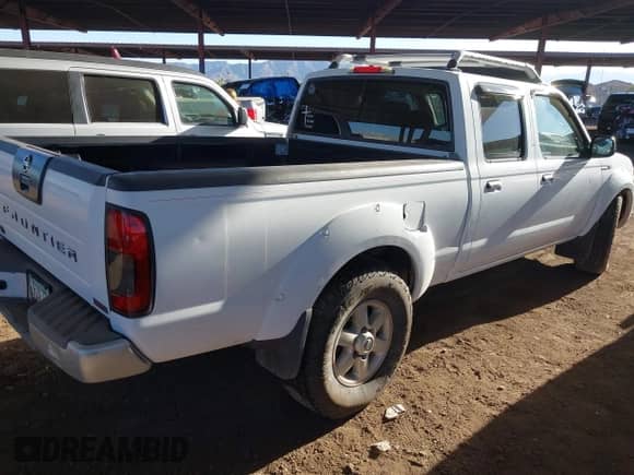 2003 Nissan Frontier SVE with VIN 1N6MD29Y93C451874, listed as a IAAI auction lot 41470198 with 216,482 mi miles and . Bid and sale history available at DreamBid. Image 4.