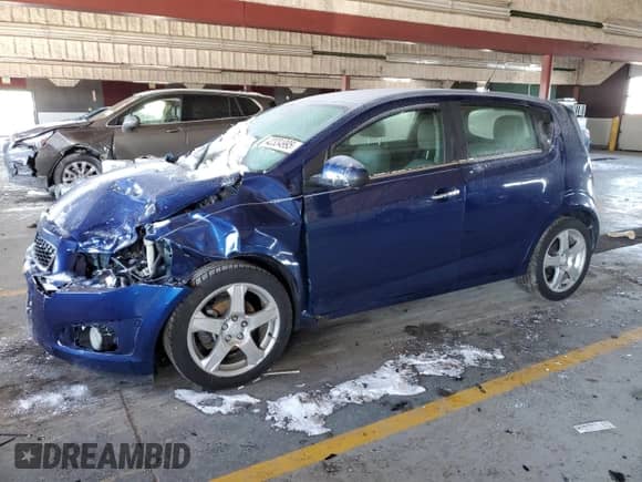2013 Chevrolet Sonic LTZ with VIN 1G1JE6SB2D4220500, listed as a Copart auction lot 42334995 with 125,000 mi miles and Salvage title. Bid and sale history available at DreamBid. Image 1.