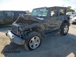 2008 Jeep Wrangler Sahara с VIN 1J4FA54128L605732, выставлен на аукционе Copart как лот 66987395 с пробегом 46 373 миль миль и Списание • Salvage title. История ставок и продаж доступна на DreamBid. Изображение 1.