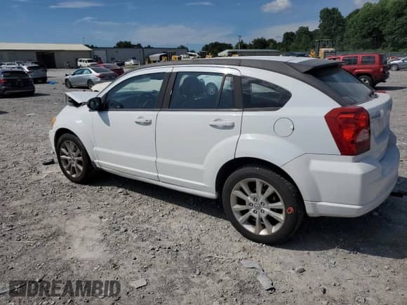 2011 Dodge Caliber Heat with VIN 1B3CB5HA9BD214435, listed as a Copart auction lot 64458005 with 138,749 mi miles and Salvage title. Bid and sale history available at DreamBid. Image 2.
