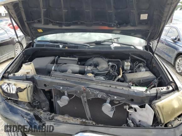2012 Toyota Tundra z VIN 5TFRU5F13CX026371, wystawiony jako Copart lot #77576564 z przebiegiem 112 512 mil mil oraz Szkoda całkowita • Salvage title. Historia ofert i sprzedaży dostępna na DreamBid. Obrazek 11.