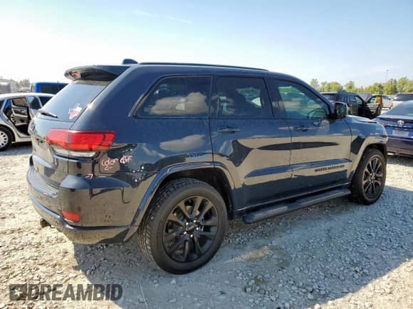 2018 Jeep Grand Cherokee Altitude with VIN 1C4RJFAG0JC294261, listed as a Copart auction lot 85189515 with 106,945 mi miles and Salvage title. Bid and sale history available at DreamBid. Image 3.