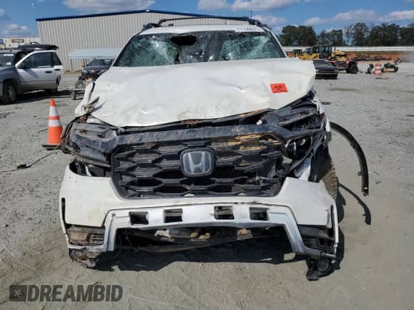 2022 Honda Passport Elite с VIN 5FNYF8H01NB015670, выставлен на аукционе Copart как лот 71130075 с пробегом Не указан миль и Списание • Salvage title. История ставок и продаж доступна на DreamBid. Изображение 5.
