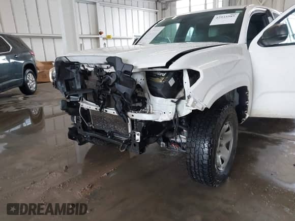 2018 Toyota Tacoma SR with VIN 5TFRX5GN9JX122396, listed as a IAAI auction lot 42933585 with 107,492 mi miles and . Bid and sale history available at DreamBid. Image 6.