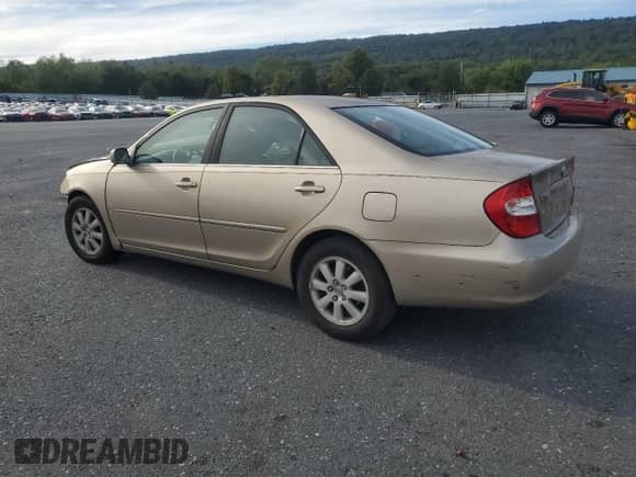 2002 Toyota Camry XLE with VIN 4T1BF30KX2U023206, listed as a Copart auction lot 84586185 with Not provided miles and Salvage title. Bid and sale history available at DreamBid. Image 2.
