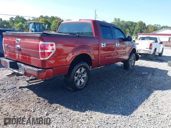 2014 Ford F-150 XLT with VIN 1FTFW1EF2EKF71609, listed as a IAAI auction lot 43157377 with 210,537 mi miles and . Bid and sale history available at DreamBid. Image 4.