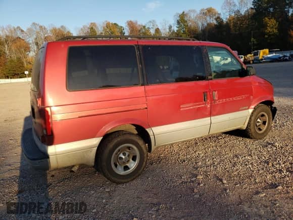 2000 Chevrolet Astro with VIN 1GNDM19W6YB180580, listed as a Copart auction lot 77676494 with 413,650 mi miles and Salvage title. Bid and sale history available at DreamBid. Image 3.