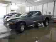 2002 Dodge Dakota Sport с VIN 1B7HG38N02S585511, выставлен на аукционе Copart как лот 57072345 с пробегом 266 306 миль миль и Списание • Salvage title. История ставок и продаж доступна на DreamBid. Изображение 1.