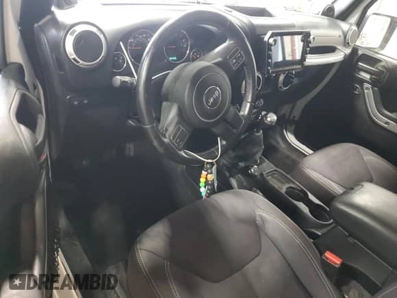 2013 Jeep Wrangler Rubicon 10th Anniversary with VIN 1C4BJWCGXDL543958, listed as a Copart auction lot 58492255 with 94,455 mi miles and Salvage title. Bid and sale history available at DreamBid. Image 8.