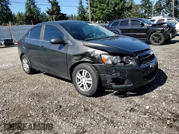 2014 Chevrolet Sonic LT z VIN 1G1JC5SG2E4147724, wystawiony jako Copart lot #81550885 z przebiegiem 124 747 mil mil oraz Szkoda całkowita • Salvage title. Historia ofert i sprzedaży dostępna na DreamBid. Obrazek 13.