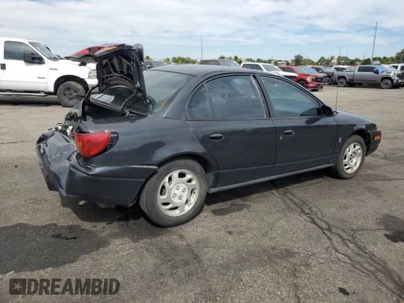 2002 Saturn SL with VIN 1G8ZJ52722Z132729, listed as a Copart auction lot 81674515 with 187,389 mi miles and Salvage title. Bid and sale history available at DreamBid. Image 3.