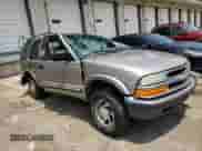 2001 Chevrolet Blazer LT z VIN 1GNDT13W91K209409, wystawiony jako Copart lot #64083034 z przebiegiem 218 833 mil mil oraz Szkoda całkowita • Salvage title. Historia ofert i sprzedaży dostępna na DreamBid. Obrazek 11.