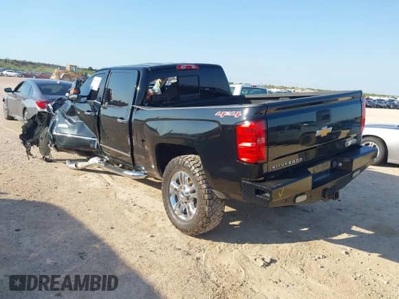 2016 Chevrolet Silverado 2500HD High Country z VIN 1GC1KXE86GF210874, wystawiony jako IAAI lot #42909459 z przebiegiem Nie podano mil oraz . Historia ofert i sprzedaży dostępna na DreamBid. Obrazek 3.