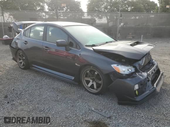 2015 Subaru WRX with VIN JF1VA1A67F9812854, listed as a Copart auction lot 70169125 with 130,862 mi miles and Salvage title. Bid and sale history available at DreamBid. Image 4.